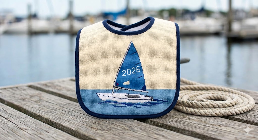 Baby wearing sailboat bib